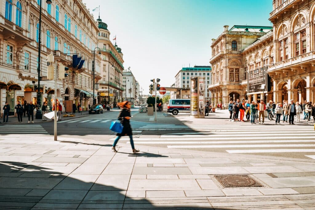 An expat woman walking in the street in Vienna