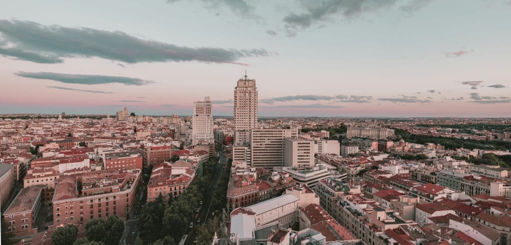Aerial view of the tall buildings of the city of Madrid in Spain. The largest building is in the centre of the photo. The photo was taken at the end of the day.